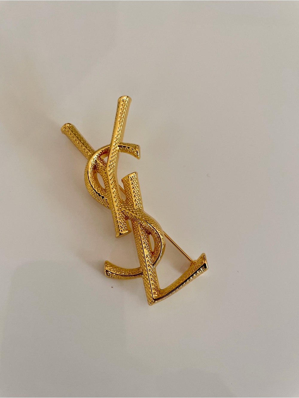 YSL Textured Gold Monogram Brooch SAINT LAURENT